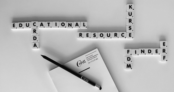 An arrangement of Scrabble Stones. Horizontally it reads "Educational Resource Finder", vertically it reads "CRDA", "Kurse", "FDM" and "ERF"
