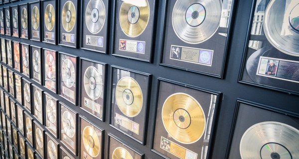 Wall with music awards, silver and golden records of famous musicians