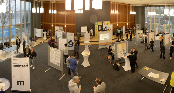 A hall with numerous information stands during the Culture Community Plenary of NFDI4Culture 2023