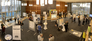 A hall with numerous information stands during the Culture Community Plenary of NFDI4Culture 2023
