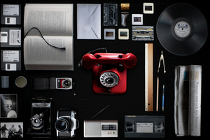 A collection of various media devices with dark background.