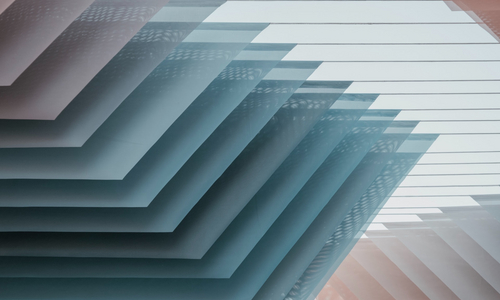 Abstract graphic of flat stacked rectangles with beige and blue shades.